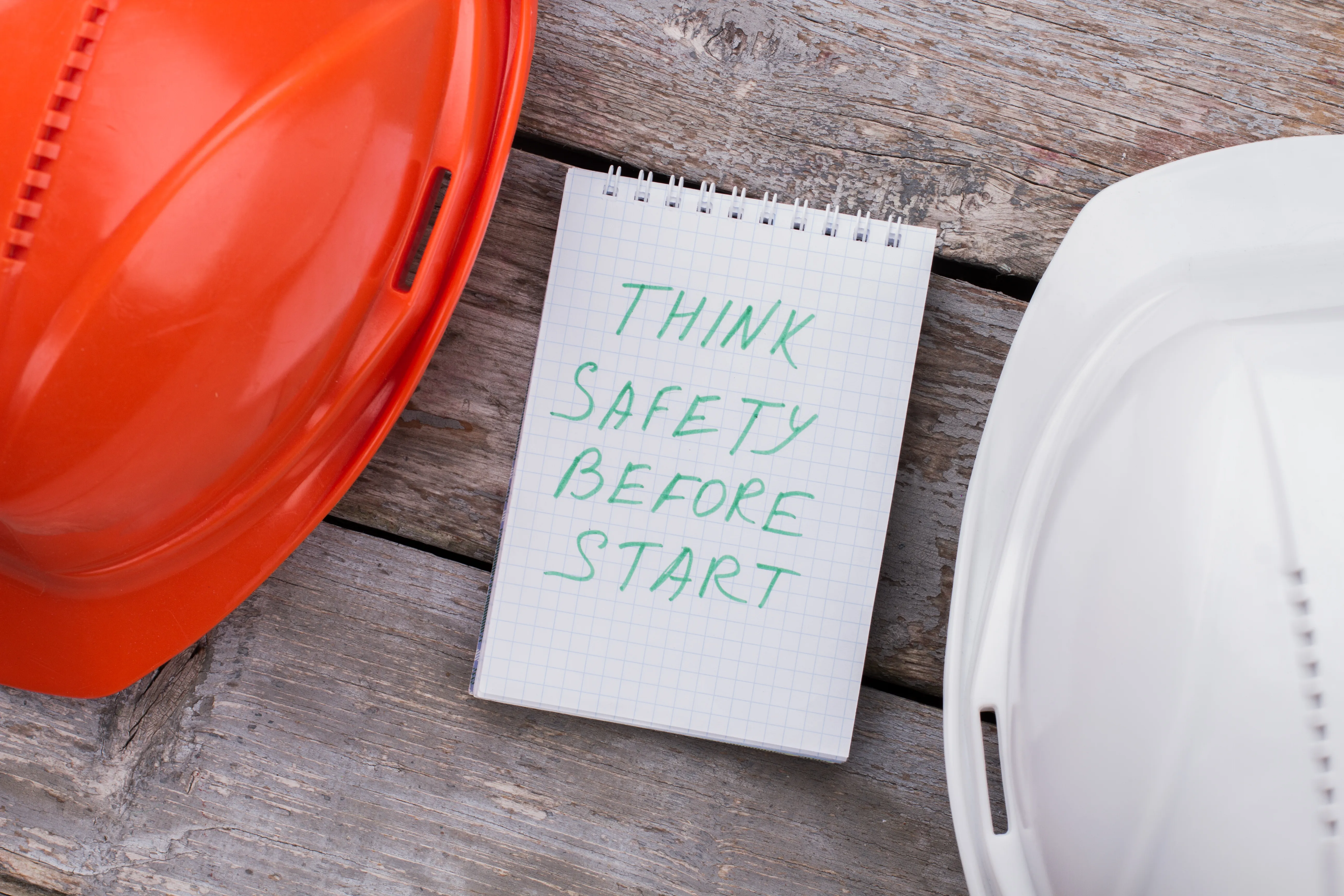 Workplace safety notice board reminding workers to think safety before starting